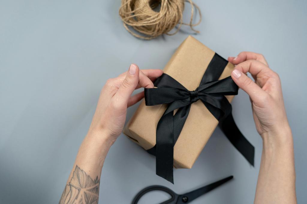 wrapped gift with black ribbon